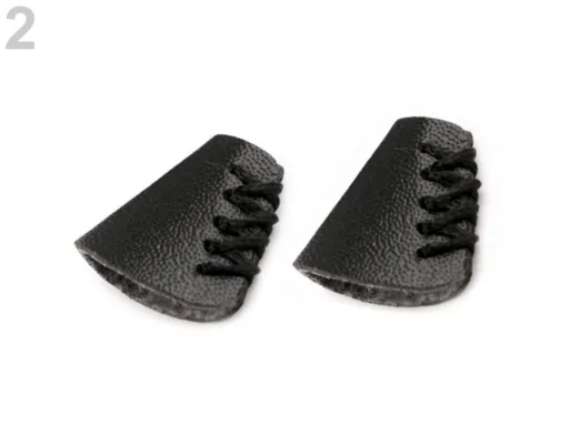 Endstück für Schnürchen aus in Schwarz, Nahaufnahme